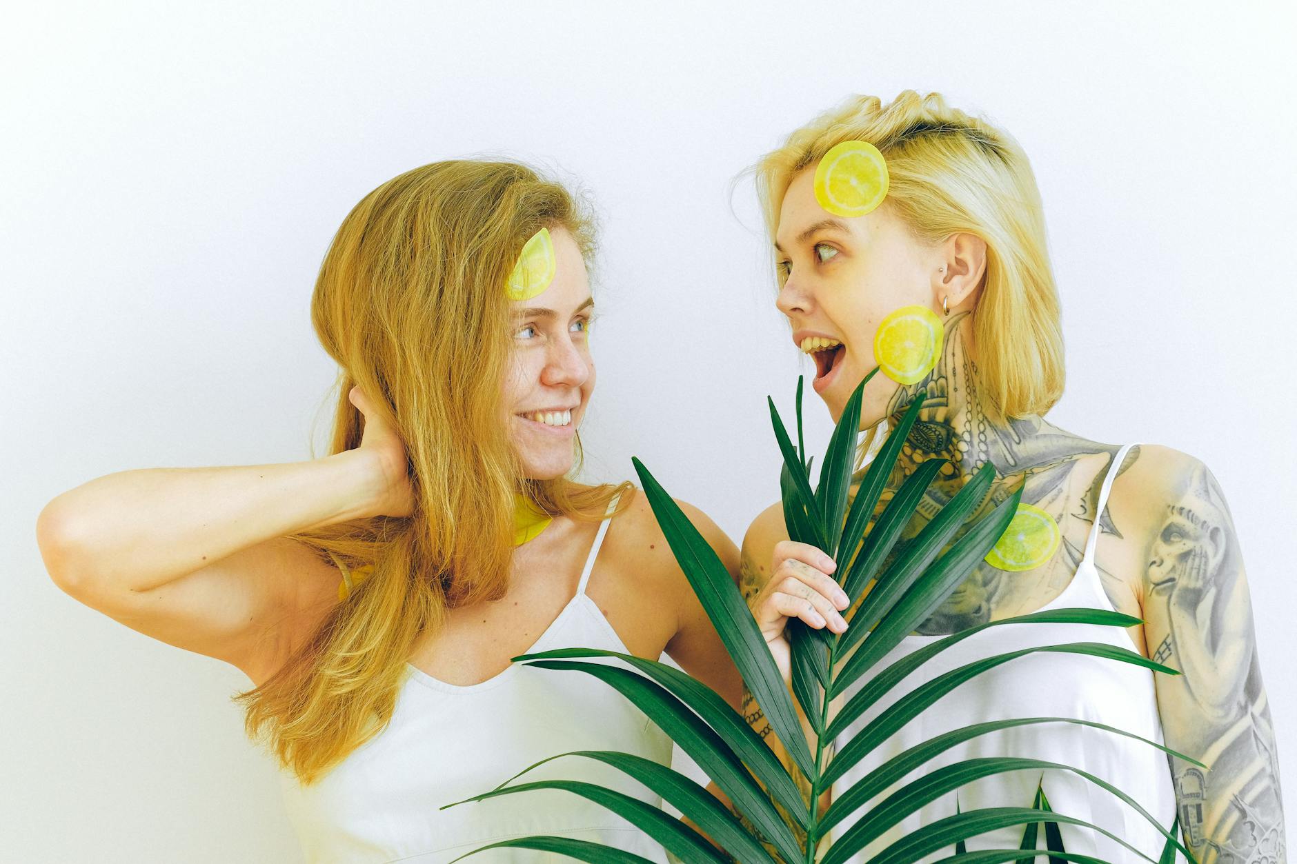 Two smiling women reconnecting indoors with joy and laughter